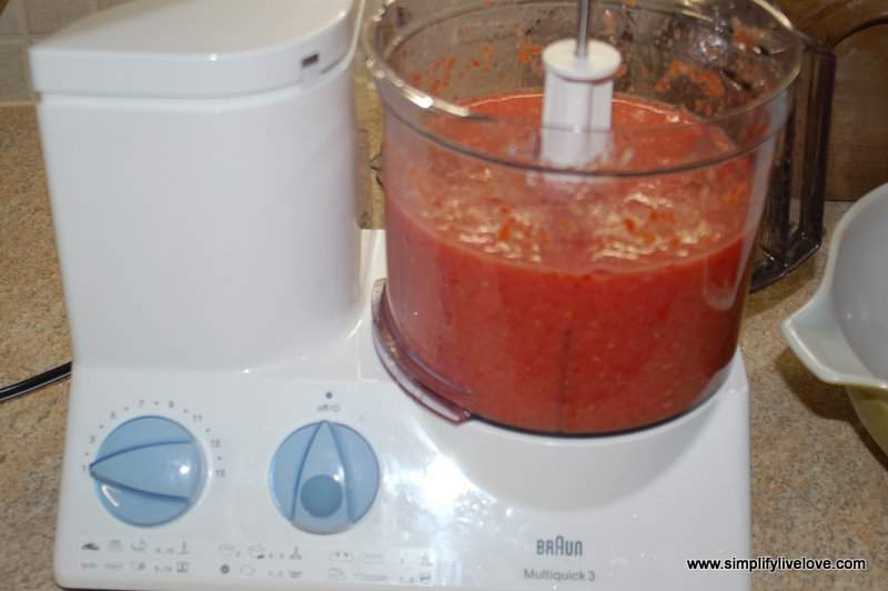 Next step in canning crushed tomatoes is puree! Dump your diced tomatoes into a food processor and puree away.