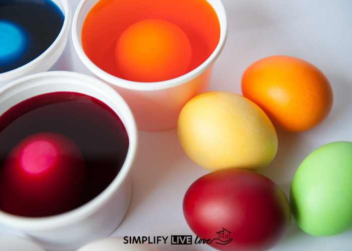 brightly colored Kool-aid in bowls to dye easter eggs