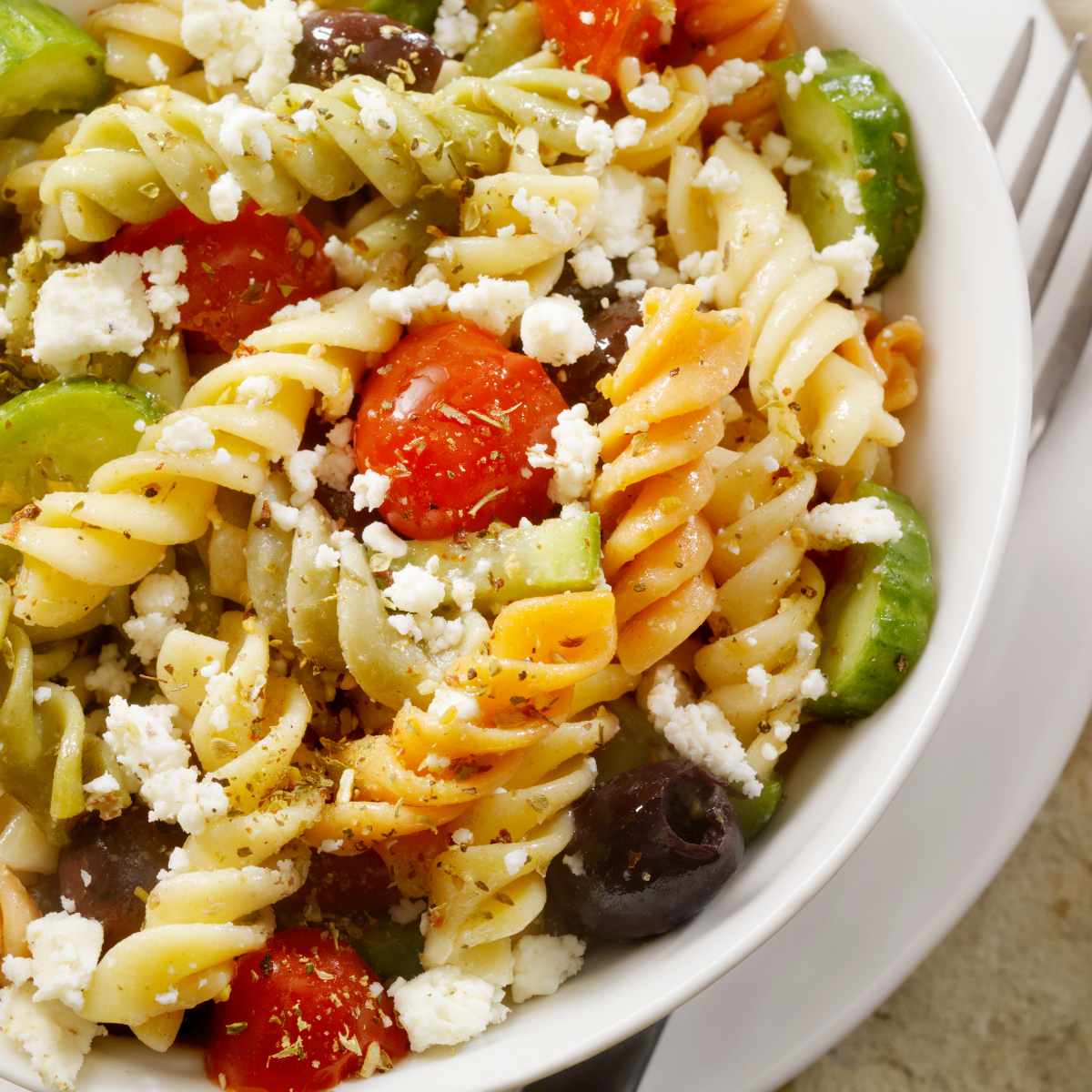 asiago pasta salad with tomatoes, olives, and cucumbers