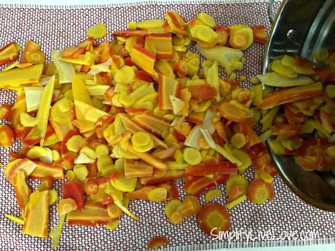 blanched garden carrots drying on a towel before freezing