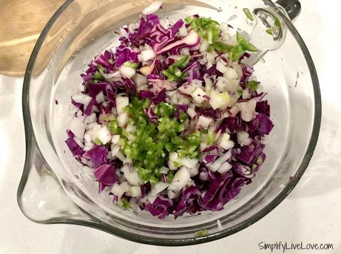 Make the red cabbage slaw to go with the salmon street tacos