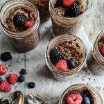 jars of healthy instant pot chocolate pudding with fresh berries
