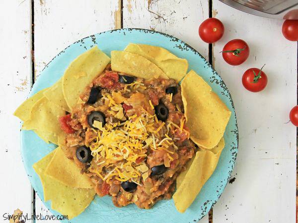 hot taco dip appetizer in blue bowl