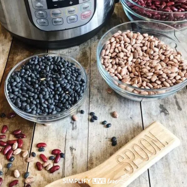 Instant Pot and dried beans in bowls on a counter
