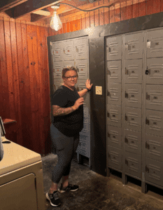 chef baldus outside the hidden door to the Blind Pig Speakeasy