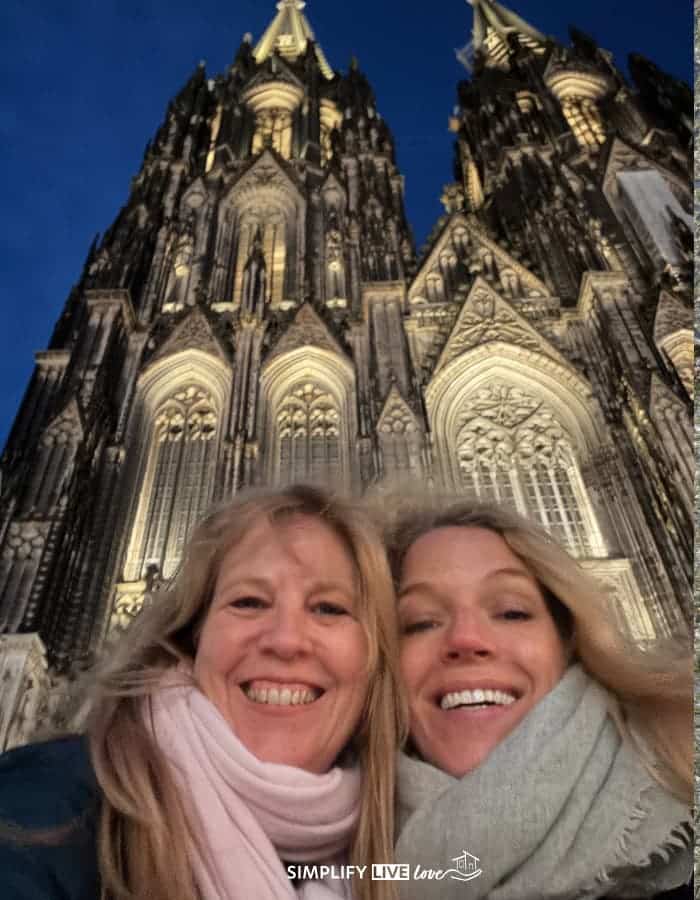 two friends outside the Kolner Dom after dark