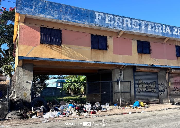 garbage outside a run down building in Dominican Republic