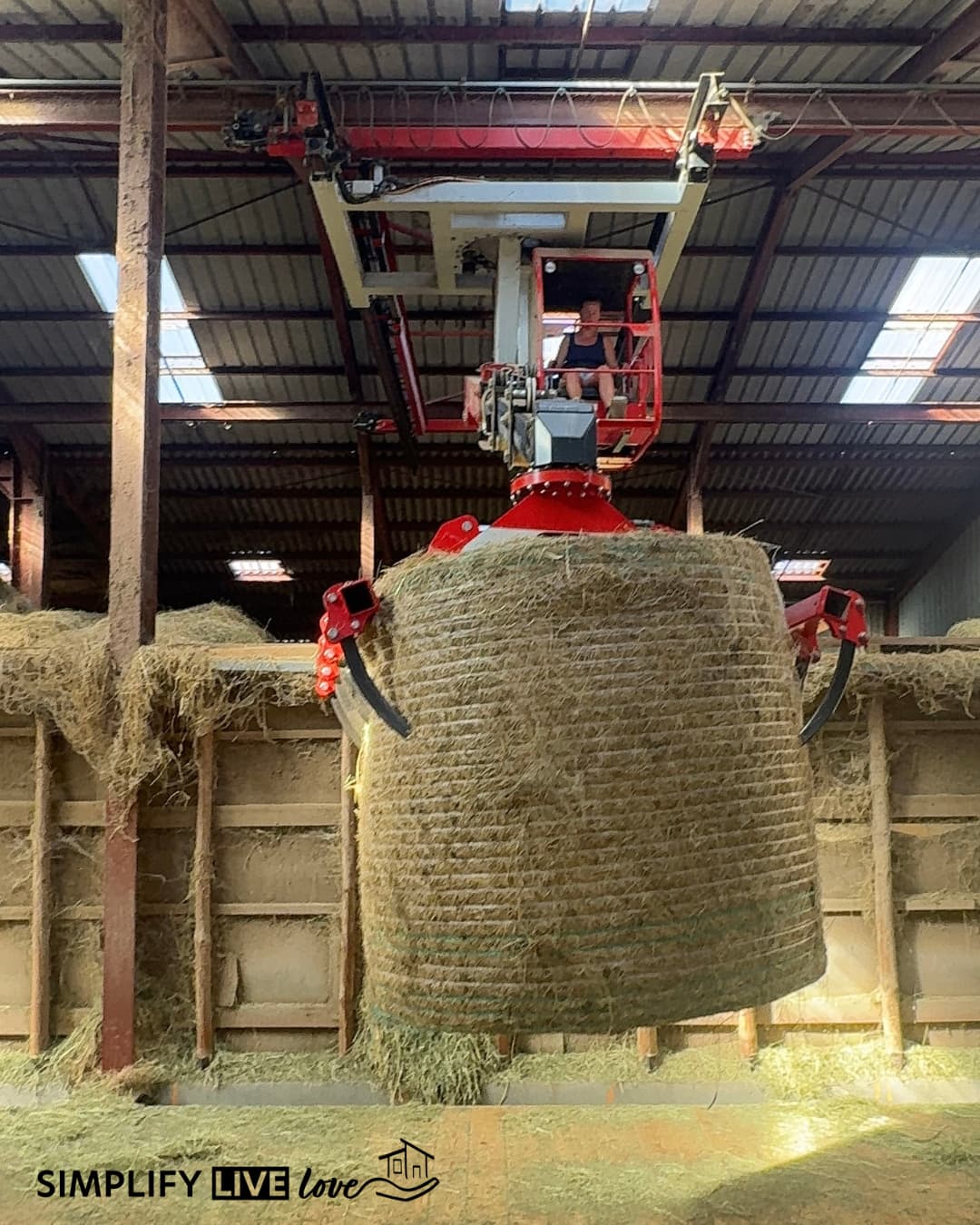 Juliette moving hay bales with the sky crane.